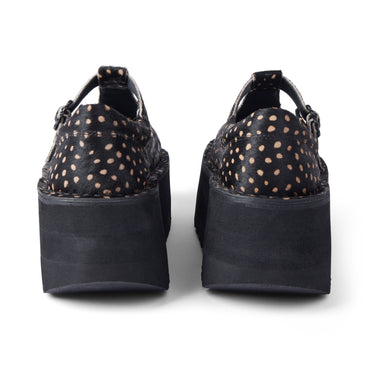 Back view of Adult Women Kick T Bar Platform Leather Black